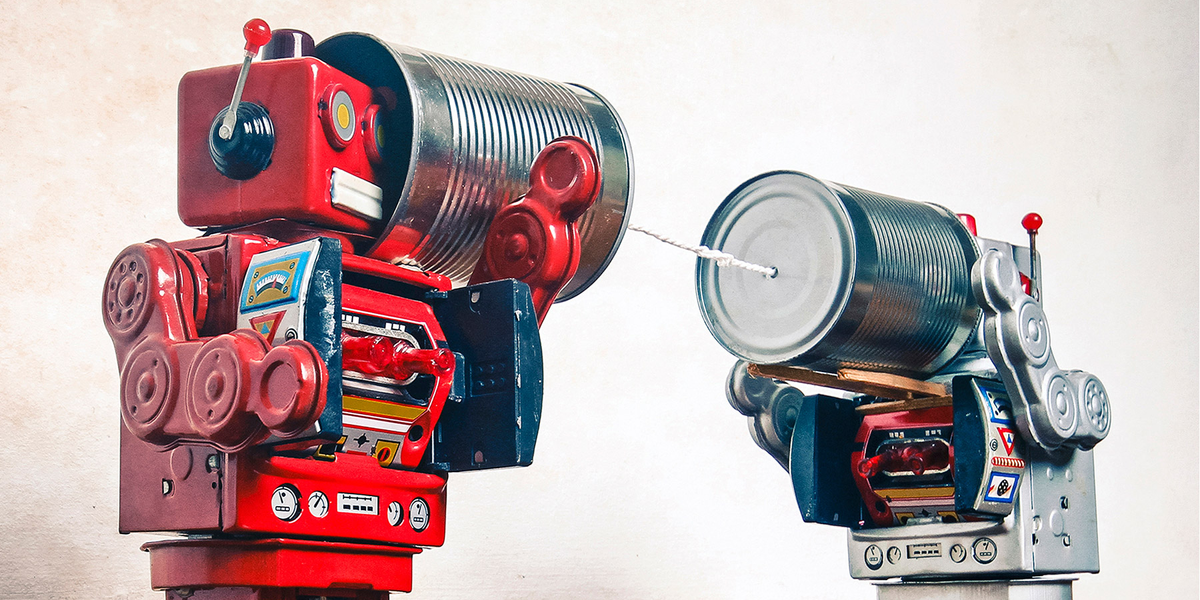 Robots talking on a tin can telephone