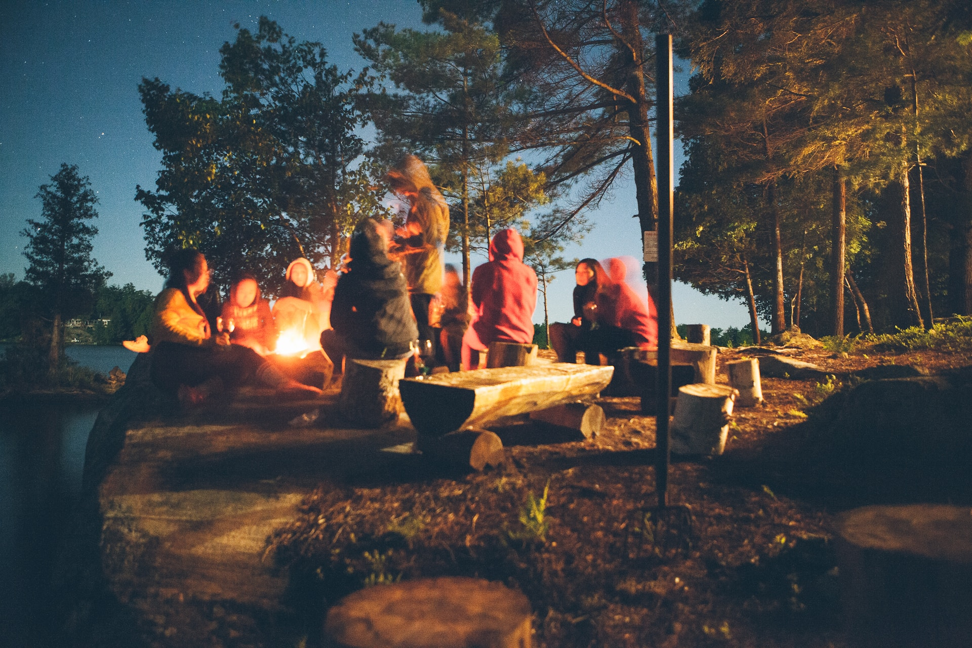 Community huddled round a campfire
